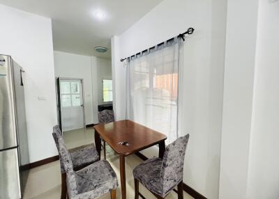 Modern dining area with table and four chairs
