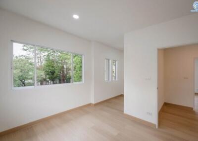 Bright empty bedroom with large windows