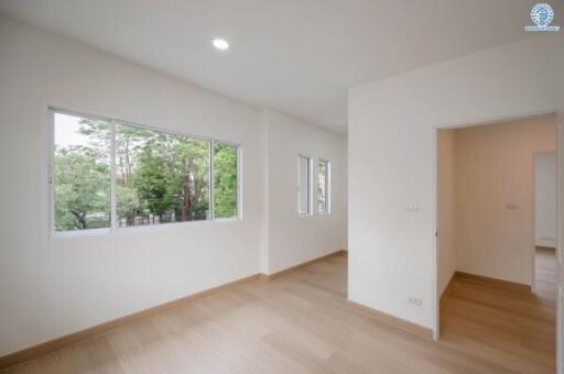 Bright empty bedroom with large windows