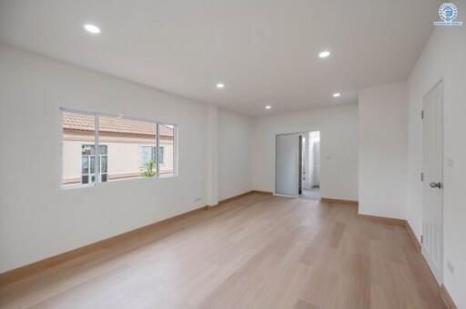 Spacious modern living room with large window