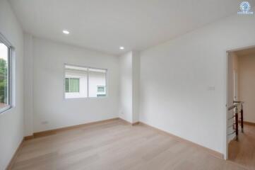 Spacious unfurnished bedroom with large windows
