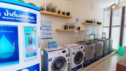 Laundry room with washing machines and a reverse osmosis system
