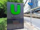 Main entrance sign of U Delight Residence located by the roadside.