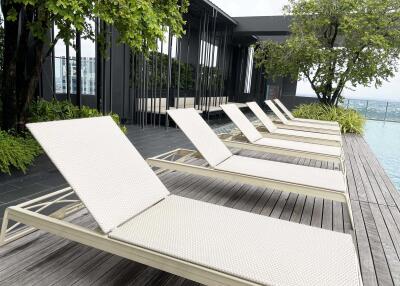 Poolside deck with lounge chairs