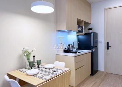 Compact kitchen and dining area with modern amenities