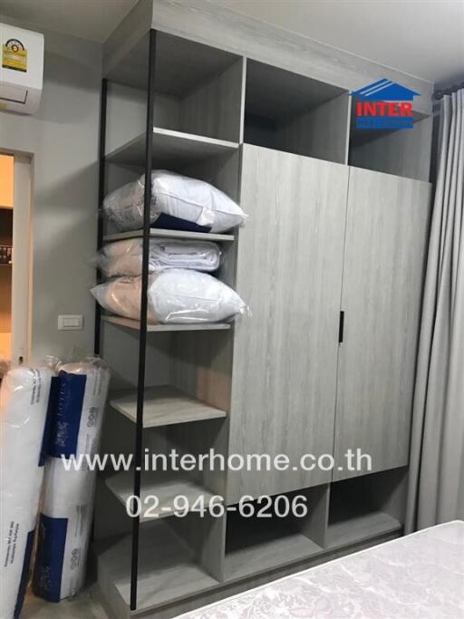 Bedroom with built-in wardrobe and bedding storage