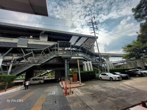 Exterior view of a modern building with parking area