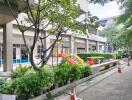 Outdoor playground with green surroundings in a residential complex