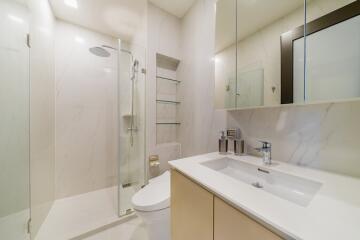 Modern bathroom with glass shower and white vanity