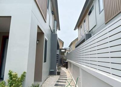 Pathway between two modern townhouses