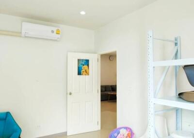 Bright room with white walls and an air conditioning unit