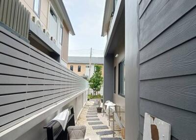 Side alley with outdoor seating and pathway