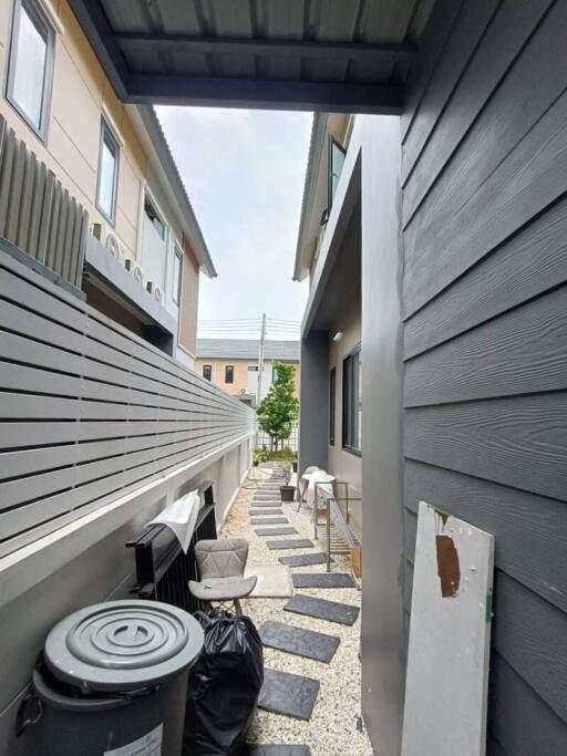 Side alley with outdoor seating and pathway