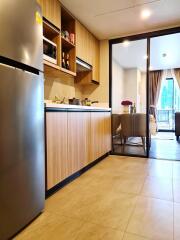 Modern kitchen with wooden cabinets and dining area