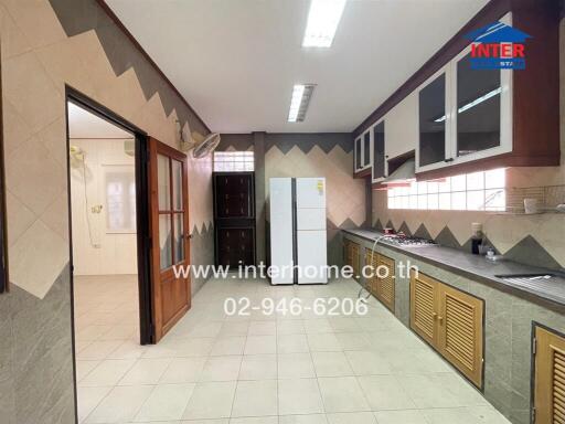 Spacious kitchen with modern appliances and ample storage