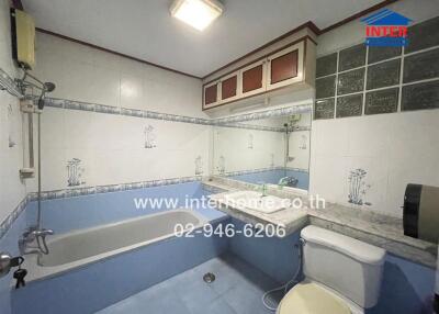 Bathroom with bathtub, sink, and toilet