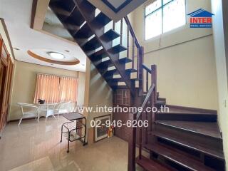 Living area with staircase and dining table