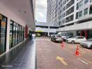 Outside view of a residential/commercial building complex with parking area