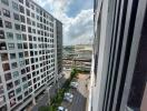 View of an urban residential apartment building from a balcony