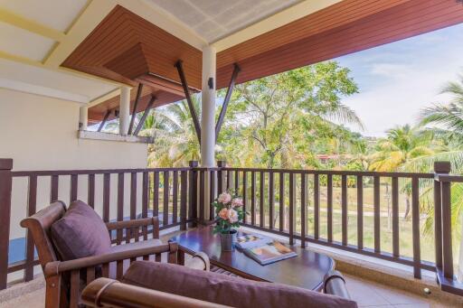 Outdoor balcony area with seating and scenic view