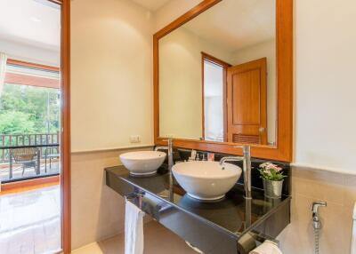 Modern bathroom with double sinks and large mirror
