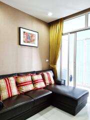 Cozy living room with leather sofa and colorful pillows