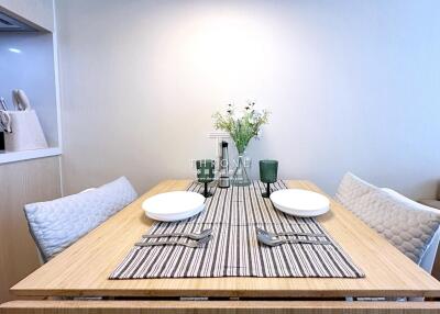 Modern dining area with table set for two