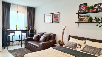 Modern bedroom with bed and seating area