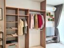 Modern bedroom with open wardrobe and natural light