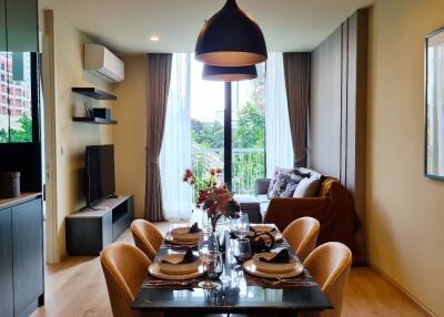 Modern living room with dining area and large window