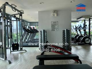 Modern fitness center with various exercise equipment