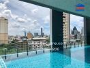 View of the city skyline from a rooftop swimming pool