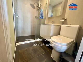 Modern bathroom with glass shower and toilet