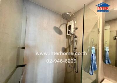 Modern bathroom with shower and glass partition