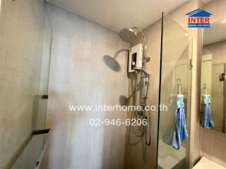 Modern bathroom with shower and glass partition
