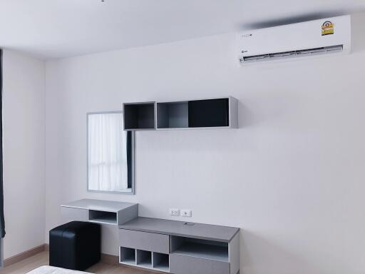 Modern minimalist bedroom with modular furniture and air conditioning