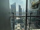 View from a high-rise balcony overlooking city skyscrapers