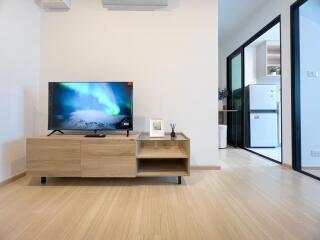 Modern living room with TV and wooden furniture