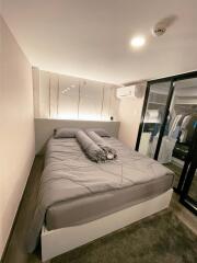 Modern and cozy bedroom with a queen-sized bed and closet space