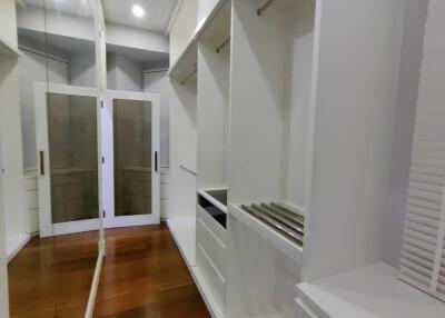 Spacious modern walk-in closet with ample storage