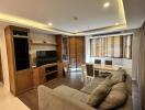 Spacious and well-lit living room with modern amenities