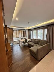 Modern living room with dining area and natural lighting