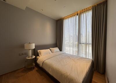 Modern, minimalistic bedroom with large windows