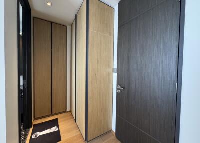 Modern hallway with storage space and wooden flooring