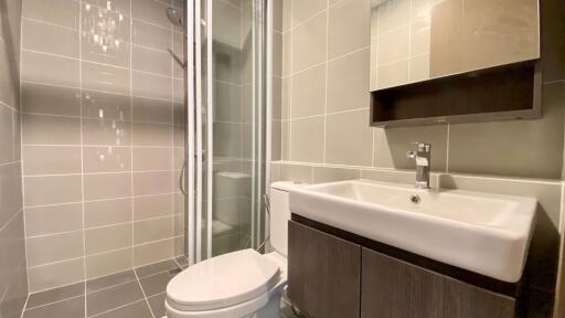 Modern bathroom with shower, toilet, and vanity