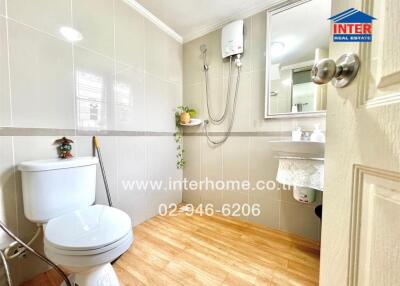 Modern bathroom with shower and wooden floor