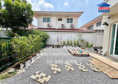 Residential house backyard with garden and pathway