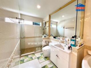 Modern bathroom with large mirror and shower