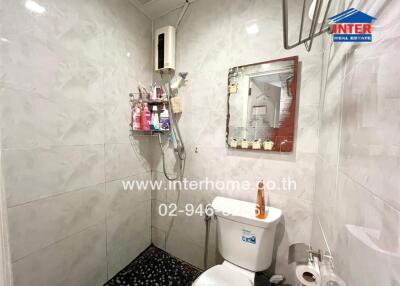 Modern bathroom with marble tiles and shower