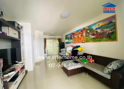 Spacious living room with artwork and entertainment unit